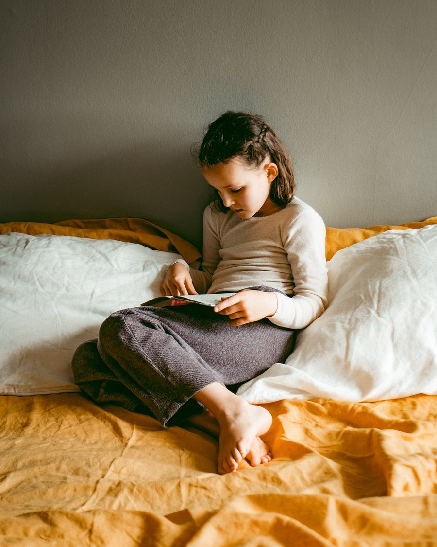 Relaxed afternoon on Marigold and Cumulus linen bedding