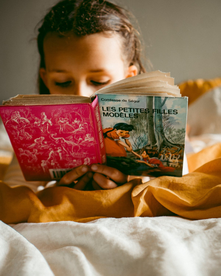 Story time in bed on Marigold linen