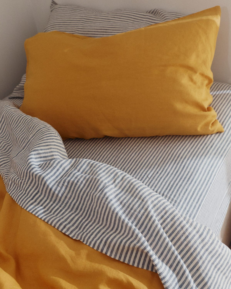Marigold linen pillow slip on a kids single bed