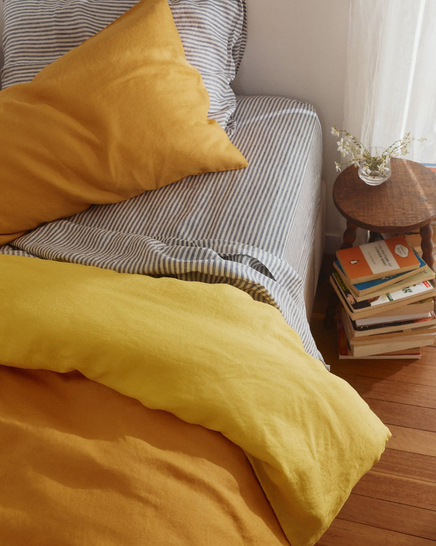 Two-toned kids linen duvet showing the Lemon Yellow reverse