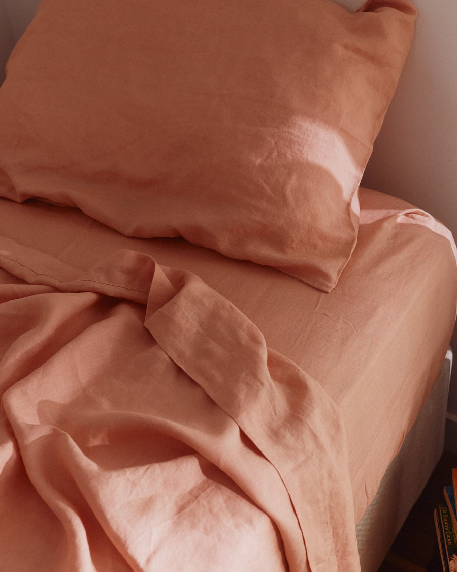 Close up of Blush stonewashed linen flat sheet and pillow slip