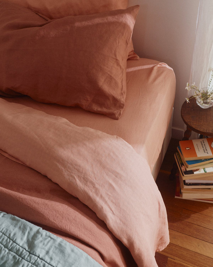 Blush linen pillow slips on a kids bed