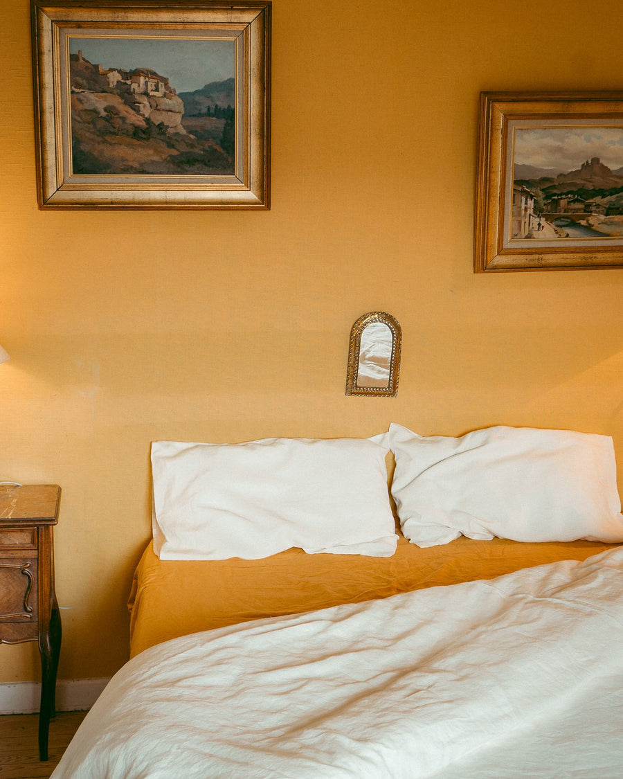 Bedroom styled with Cumulus pillow slips and Marigold sheets