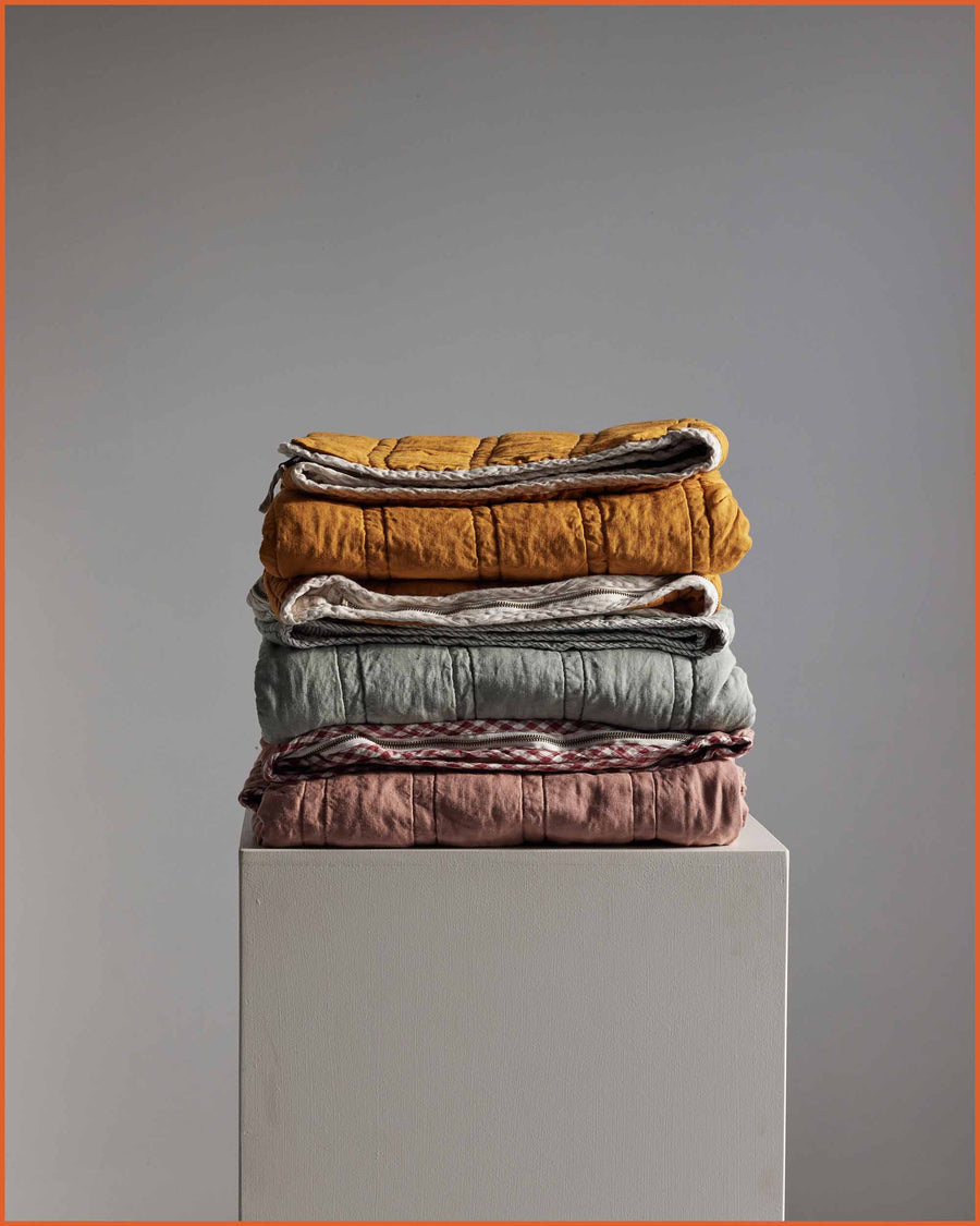 THE QUILTED SLEEPING BAG · GOLD & FLAX STRIPE ·
