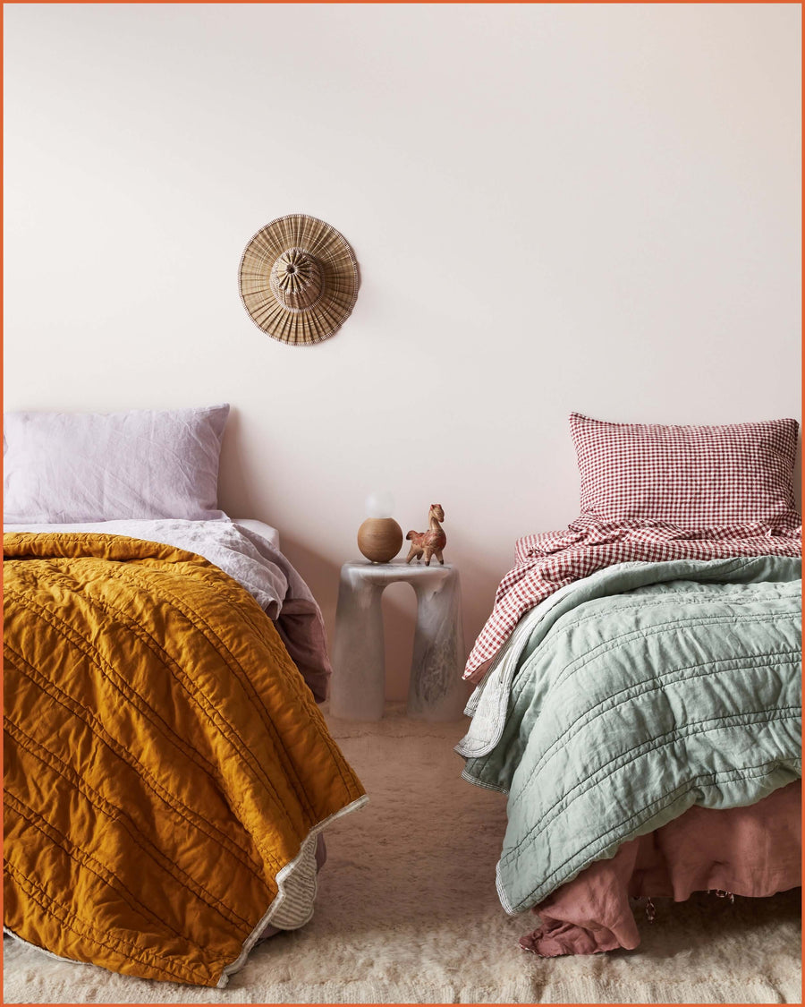 THE QUILTED SLEEPING BAG · GOLD & FLAX STRIPE ·