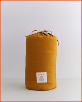 THE QUILTED SLEEPING BAG · GOLD & FLAX STRIPE ·